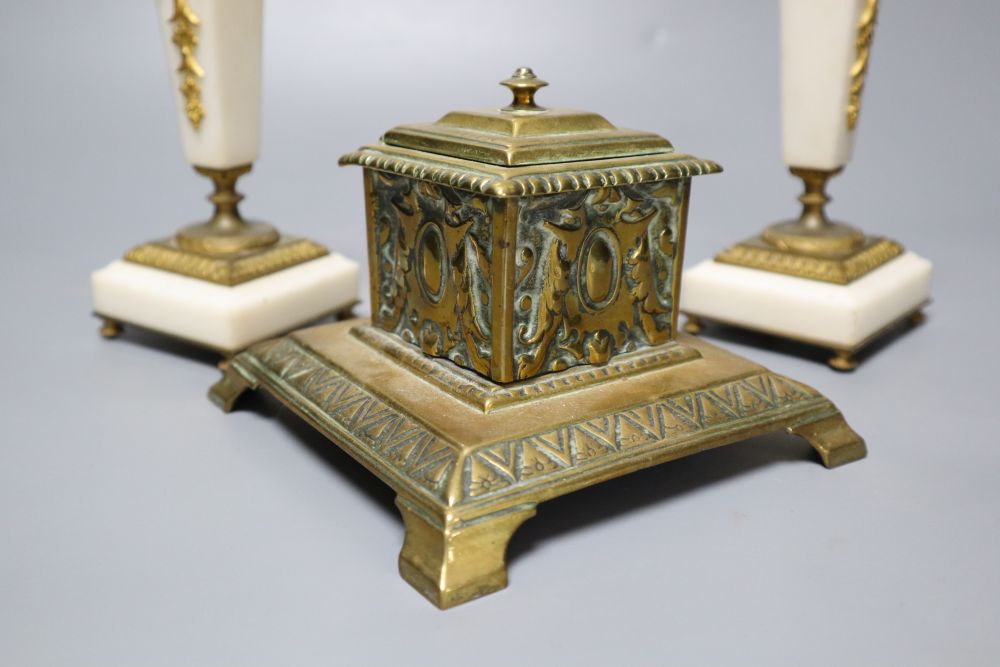 A pair of ormolu mounted alabaster candlesticks, 18cm and a cast brass inkwell with ceramic liner, 14cm wide